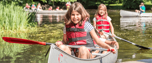 Girls kayaking at camp Girls kayaking at camp